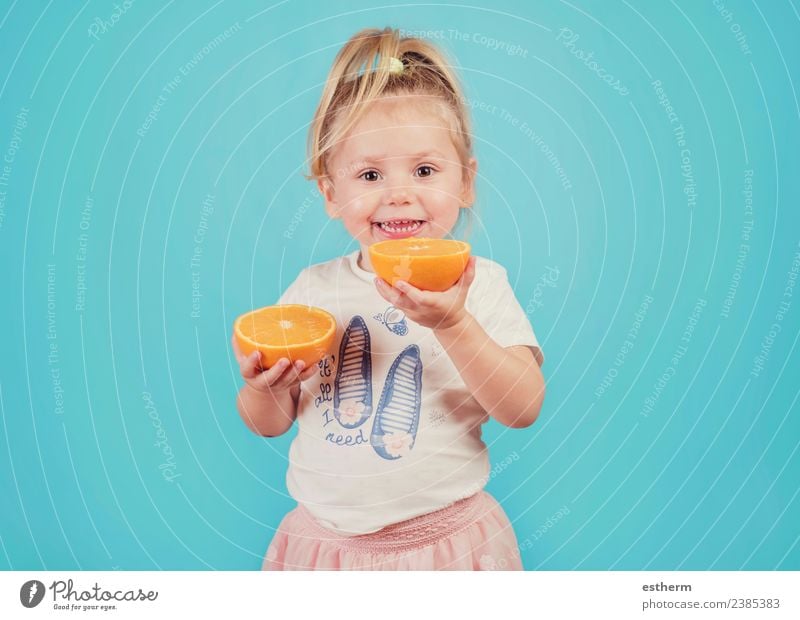 smiling baby with an orange on blue background Food Fruit Orange Nutrition Eating Lunch Joy Healthy Eating Human being Feminine Baby Girl Infancy 1 3 - 8 years