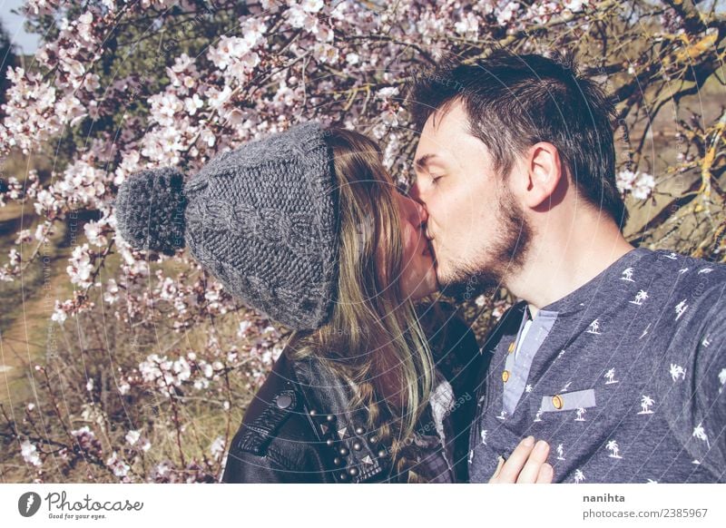 Young couple kissing in a sunny spring day Lifestyle Style Joy Wellness Harmonious Senses Human being Masculine Feminine Young woman Youth (Young adults)