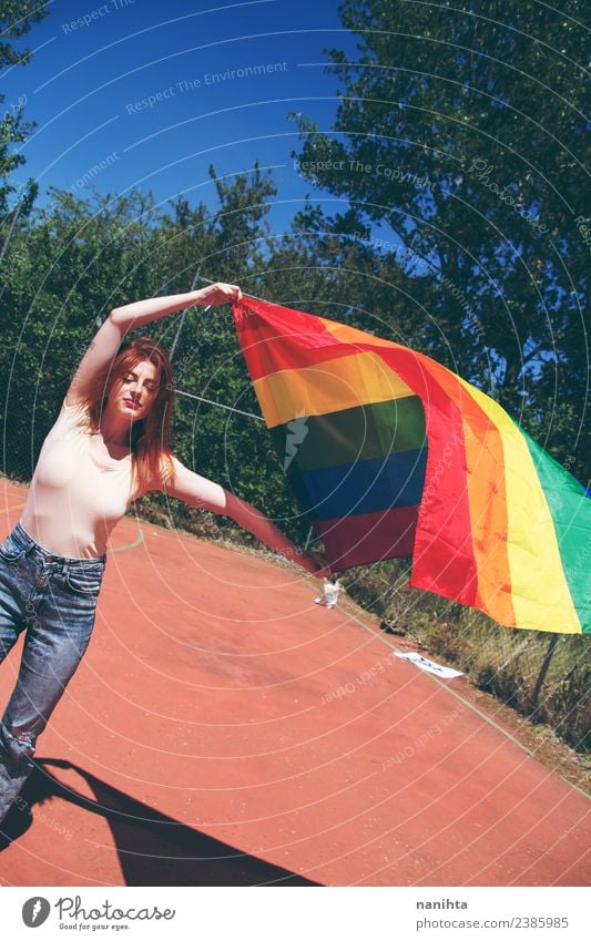Young woman holding a rainbow flag Lifestyle Style Design Human being Feminine Homosexual Youth (Young adults) 1 18 - 30 years Adults Culture Youth culture