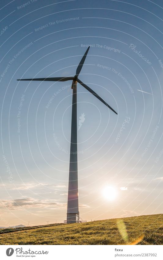 Wind energy Wind turbine in back light Wind energy plant Eco-friendly Energy Energy industry Environment Environmental damage Environmental protection Clouds