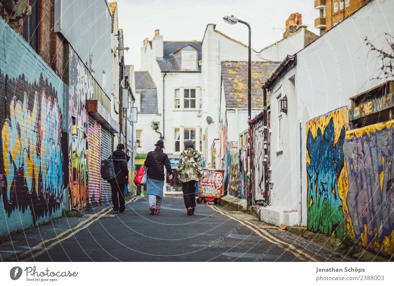 Teenagers in an alley in Brighton, England Town Downtown Outskirts House (Residential Structure) Building Architecture Facade Esthetic Multicoloured Graffiti