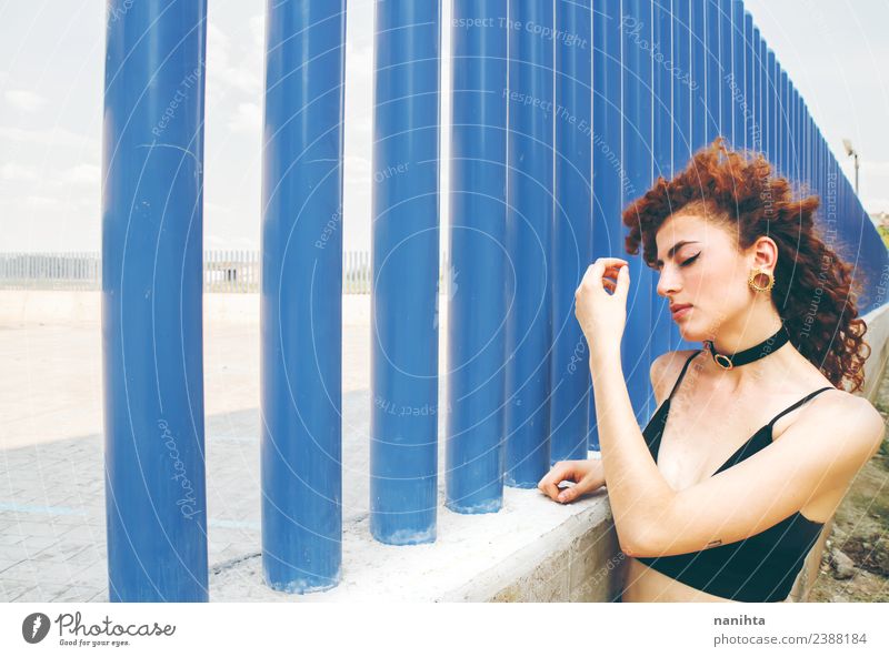 Young redhead woman against a blue wall Lifestyle Style Beautiful Hair and hairstyles Skin Face Human being Feminine Young woman Youth (Young adults) 1