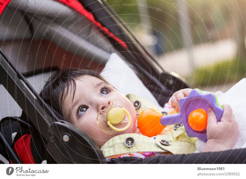 Little baby with yellow dummy resting at baby carriage Lifestyle Beautiful Relaxation Child Human being Baby Infancy Youth (Young adults) 1 0 - 12 months Nature