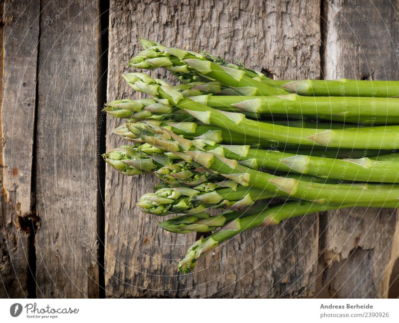 Fresh green organic asparagus on wood Food Vegetable Nutrition Organic produce Vegetarian diet Diet Healthy Eating antioxidant Asparagus Background picture