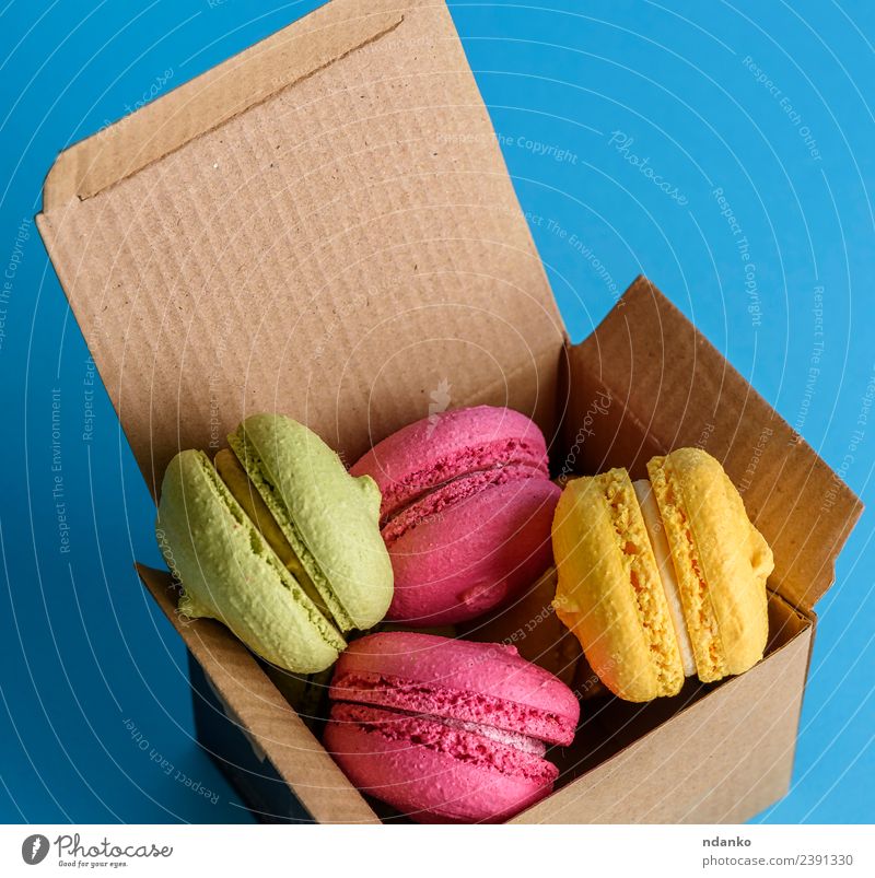 multicolored cakes Dessert Candy Paper Eating Bright Above Blue Yellow Green Pink Colour Macaron food colorful Vanilla french sweet biscuit Baking Bakery Almond