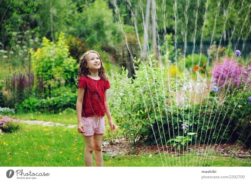 Kid girl playing with garden sprinkler Joy Happy Playing Summer Garden Child Infancy Weather Warmth Flower Grass Drop To enjoy Smiling Jump Happiness Hot Bright