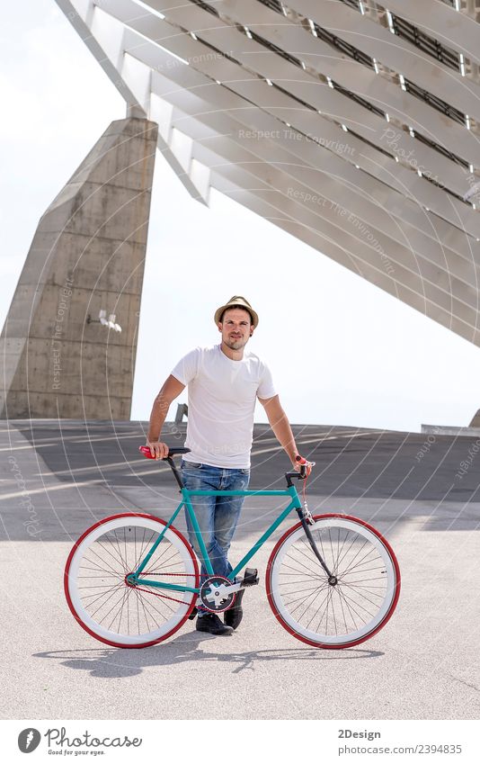 Young Man Biking in a Summer Day on the city Lifestyle Style Joy Relaxation Leisure and hobbies Vacation & Travel Tourism Sports Cycling Human being Masculine