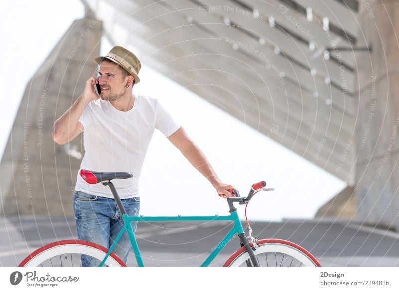 Young handsome guy with a bicycle Lifestyle Style Joy Beautiful Vacation & Travel Adventure Profession Business Telephone Technology Human being Masculine