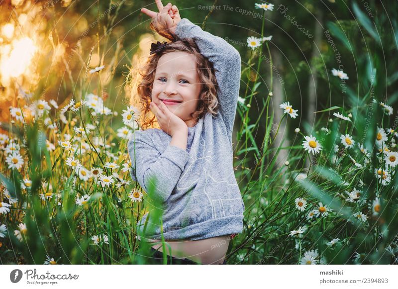 happy kid girl fooling in summer Joy Happy Beautiful Face Playing Vacation & Travel Summer Sun Child Woman Adults Infancy Nature Weather Warmth Flower Grass