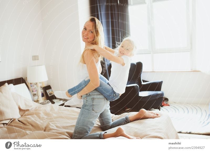 happy family playing at home Lifestyle Joy Relaxation Playing Bedroom Toddler Parents Adults Mother Family & Relations Smiling Sleep Together Small Funny Modern