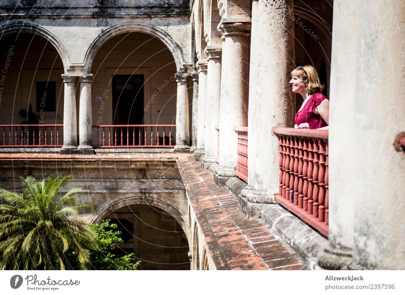 Young woman standing on the balcony of an old building Cuba Havana Column 1 Person Sit Relaxation Break Restful Bench To enjoy Calm Wall (barrier)