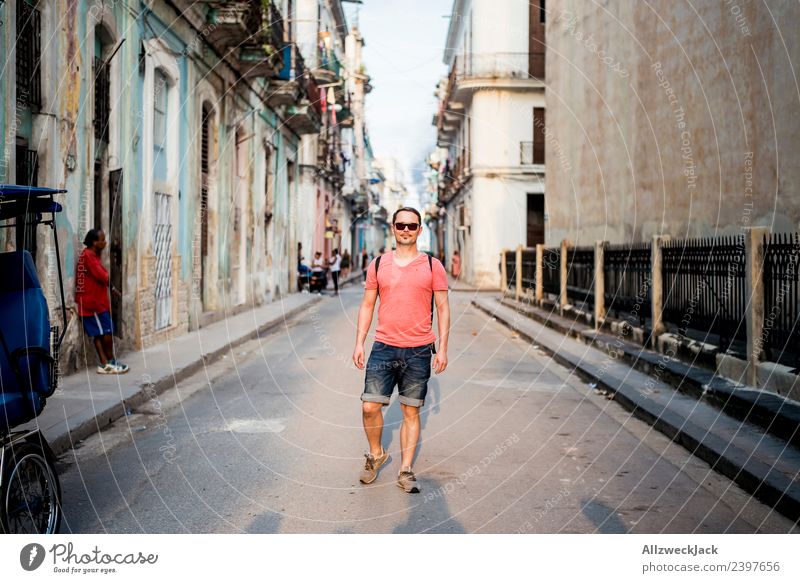 Man walking in the streets of Havana Cuba Island Socialism Vacation & Travel Travel photography Trip Sightseeing Sunset Street Alley Town Blue sky Clouds