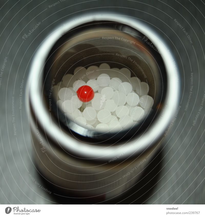 Red Pill gives wings Tin Glass Sphere Glittering Round Gray White Uniqueness Integration Medication Placebo Colour photo Interior shot Deserted Exceptional