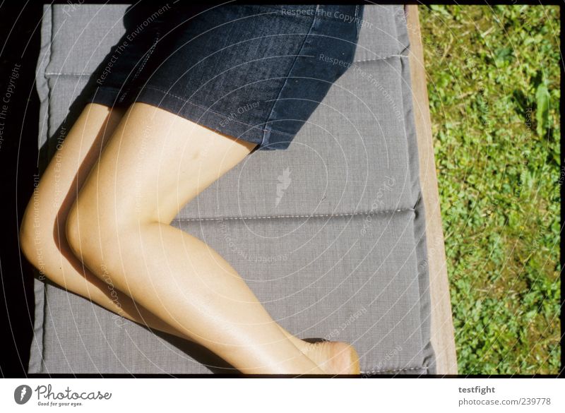 be Well-being Relaxation Calm Human being Feminine Woman Adults Legs 1 Grass Skirt Lie Warm-heartedness Comfortable Contentment Couch Sunbathing Colour photo