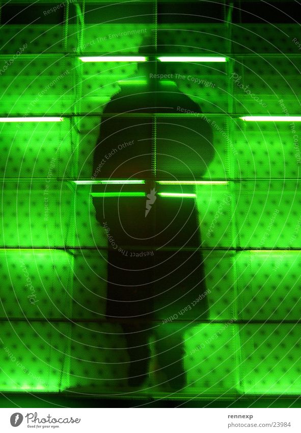 The Black Man Green Grating Neon light Large Might Captured Facade Jail sentence Night shot Silhouette Yeast Criminal Strange Mysterious Agent Light Flashy