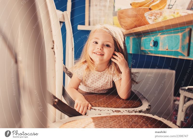 happy toddler girl playing in kitchen Joy Happy Beautiful Playing Child Baby Toddler Blonde Smiling Laughter Small Cute White Delightful Caucasian colorful