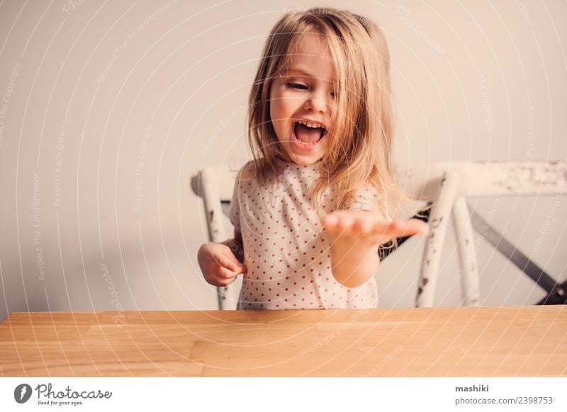 happy toddler girl in pyjamas playing in kitchen Joy Happy Beautiful Playing Child Baby Toddler Blonde Smiling Laughter Small Cute White Delightful Caucasian