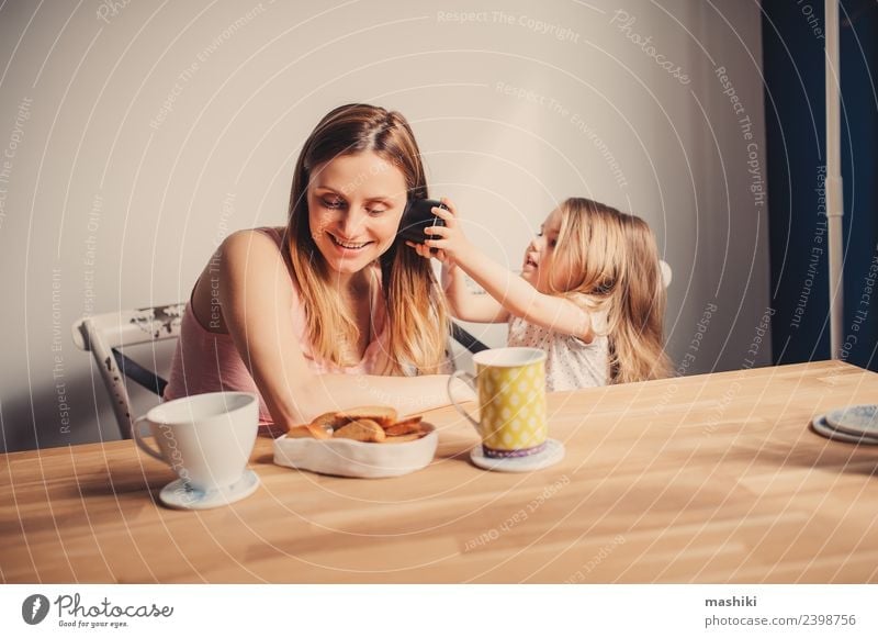 mom playing with toddler daughter at home Breakfast Tea Joy Happy Beautiful Playing Table Kitchen Child Baby Toddler Parents Adults Mother Family & Relations