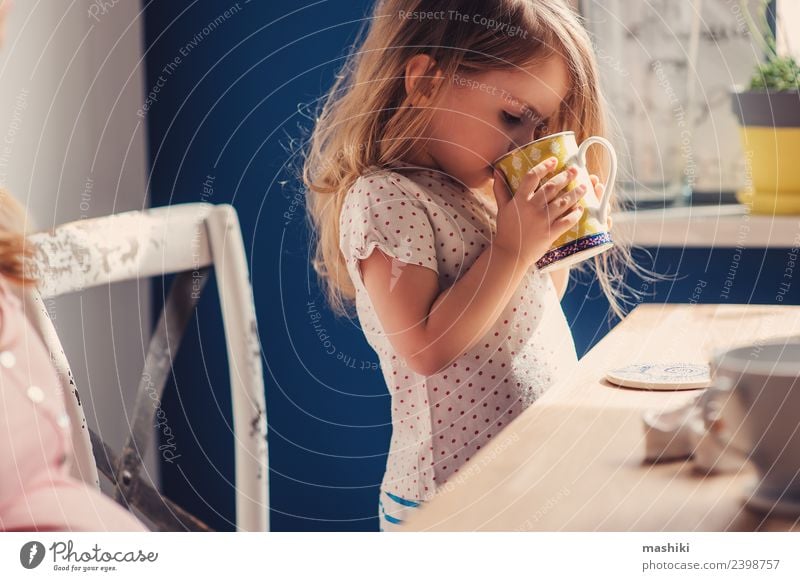 cute toddler girl drinking tea for breakfast Breakfast Tea Joy Happy Beautiful Playing Table Kitchen Child Baby Toddler Parents Adults Mother Family & Relations