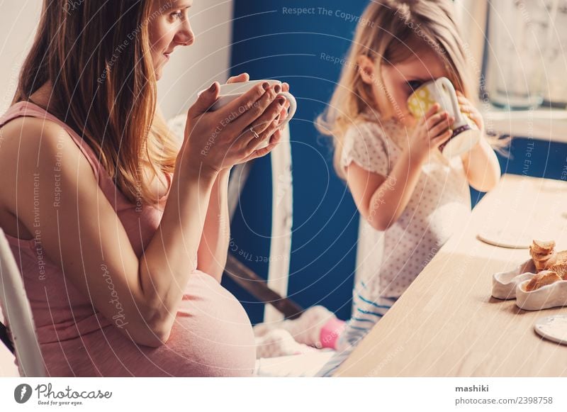 toddler girl with pregnant mother at home Breakfast Tea Joy Playing Table Kitchen Child Baby Toddler Parents Adults Mother Family & Relations Blonde Smiling