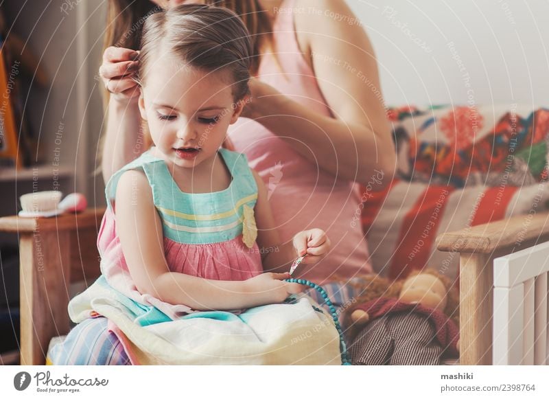 mother brushing daughters hair at home Lifestyle Happy Beautiful Playing Baby Toddler Woman Adults Parents Mother Family & Relations Flower Hairbrush Love Sit