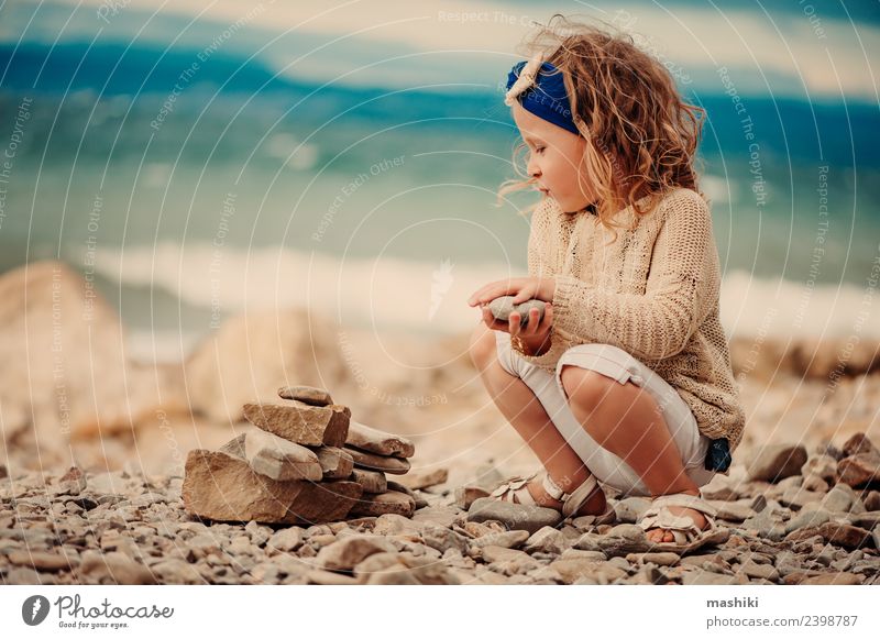 child girl playing with stones on the beach Lifestyle Leisure and hobbies Vacation & Travel Summer Summer vacation Sun Beach Ocean Child Girl 3 - 8 years