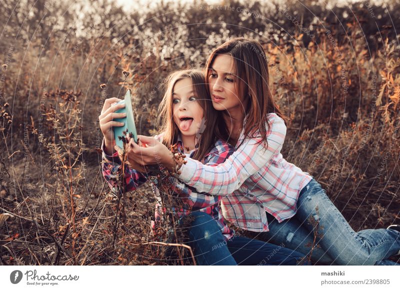 happy mother and daughter making selfie outdoor Lifestyle Joy Vacation & Travel Summer Telephone Parents Adults Mother Family & Relations Nature Autumn Meadow