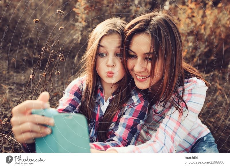 happy mother and daughter making selfie outdoor Lifestyle Joy Vacation & Travel Summer Telephone Parents Adults Mother Family & Relations Nature Autumn Meadow