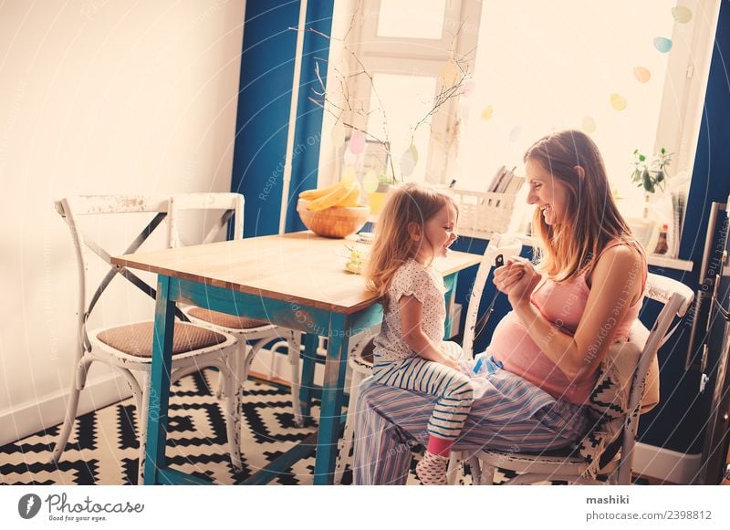 happy toddler girl playing with pregnant mother Breakfast Tea Kitchen Child Baby Toddler Parents Adults Mother Sister Family & Relations Friendship Smiling Love