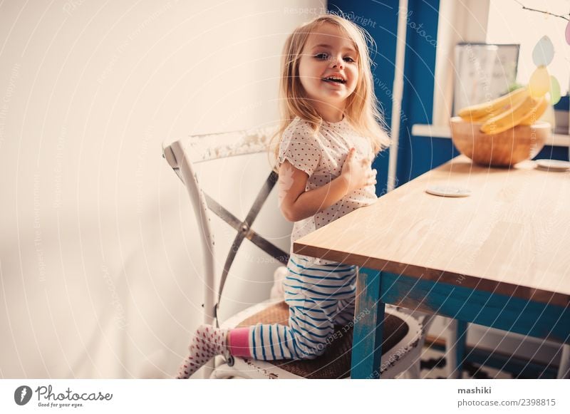 happy toddler playing in kitchen Breakfast Lifestyle Joy Happy Beautiful Face Playing Kitchen Child Baby Toddler Smiling Laughter Sit Happiness Small Modern