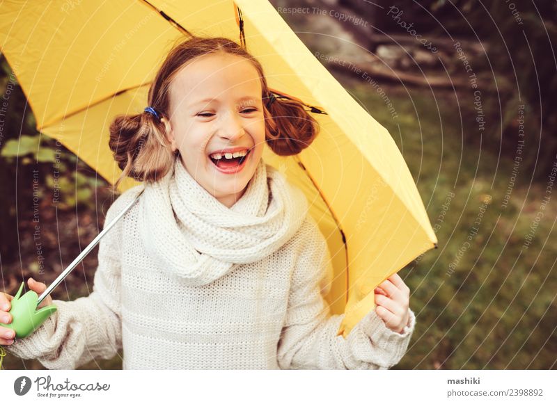happy kid girl hiding under umbrella Lifestyle Joy Happy Playing Knit Garden Child Infancy Nature Autumn Weather Rain Park Sweater Drop Funny Wet Cute Yellow