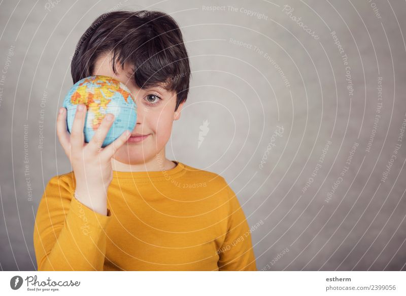 smiling boy with a earth globe covering his eye Joy Vacation & Travel Tourism Trip Adventure Human being Masculine Child Toddler Infancy 1 8 - 13 years Sphere