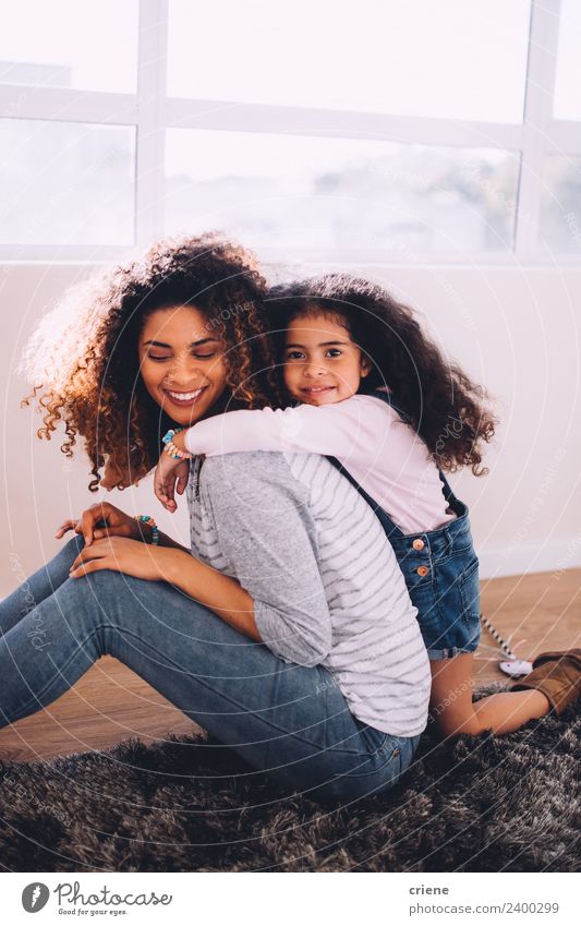 african daughter hugging her mom at home Happy Beautiful Life House (Residential Structure) Child Woman Adults Parents Mother Family & Relations Infancy Smiling