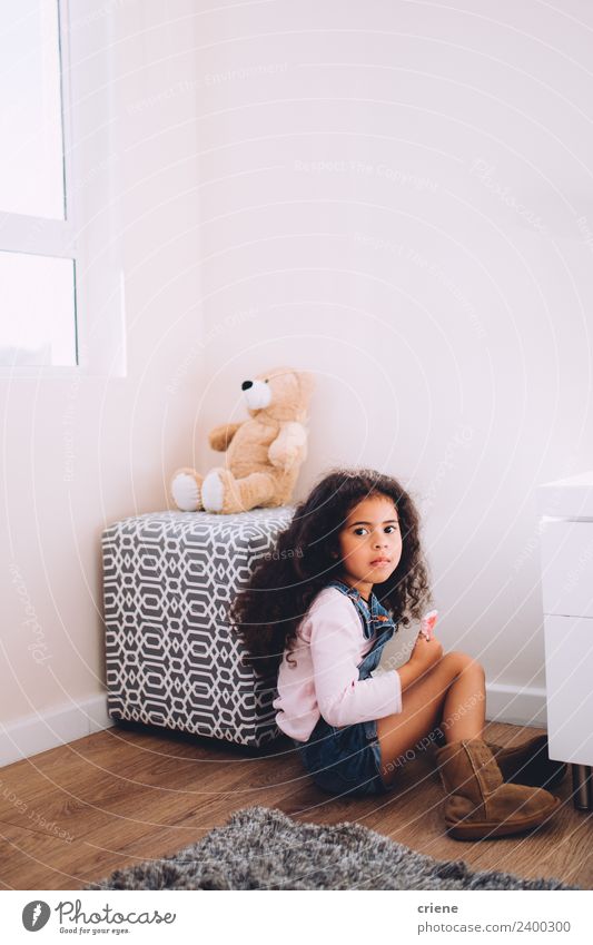 African girl sits next to her teddy bear at home Happy Beautiful Child Boots Toys Teddy bear Sit Small Cute Bear Home room kid background window Carpet african