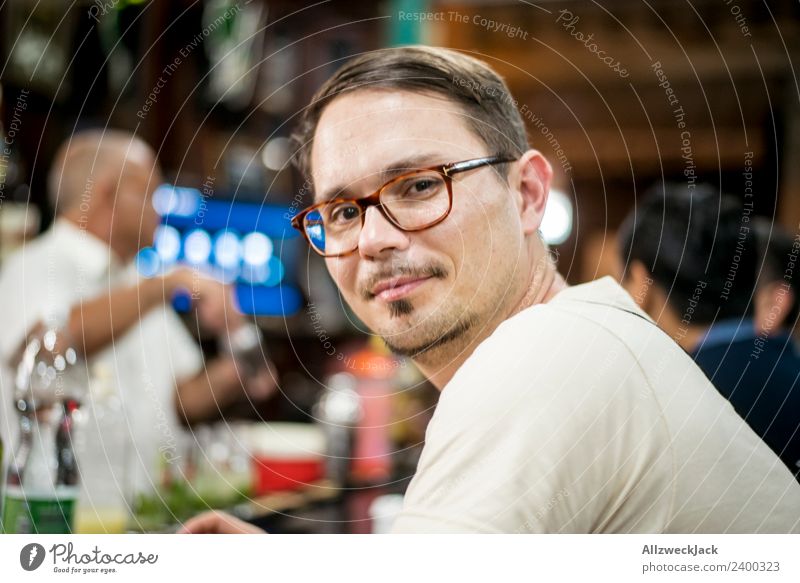 Portrait young man with glasses at a bar Cuba Havana Bar Young man Eyeglasses Person wearing glasses Looking into the camera Contentment Smiling
