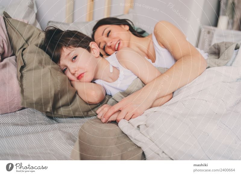 mother and child son sleeping together in bed Lifestyle Relaxation Bedroom Child Toddler Boy (child) Parents Adults Mother Family & Relations Infancy Smiling