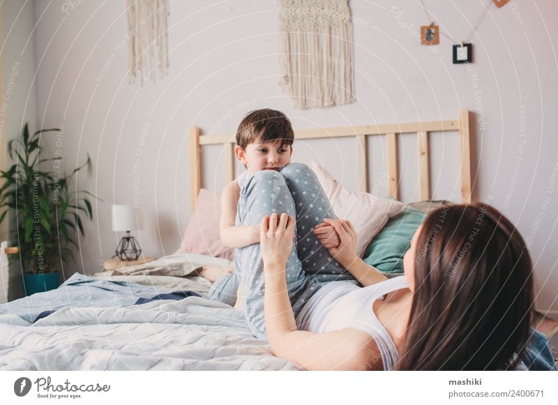 happy mother and child son playing in bed Lifestyle Joy Happy Relaxation Playing Bedroom Child Toddler Boy (child) Parents Adults Mother Family & Relations