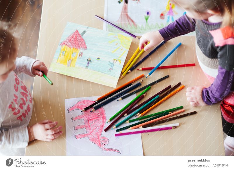 Little girls drawing the colorful pictures Lifestyle Joy Happy Handcrafts Table Kindergarten Child School Craft (trade) Human being Girl Family & Relations