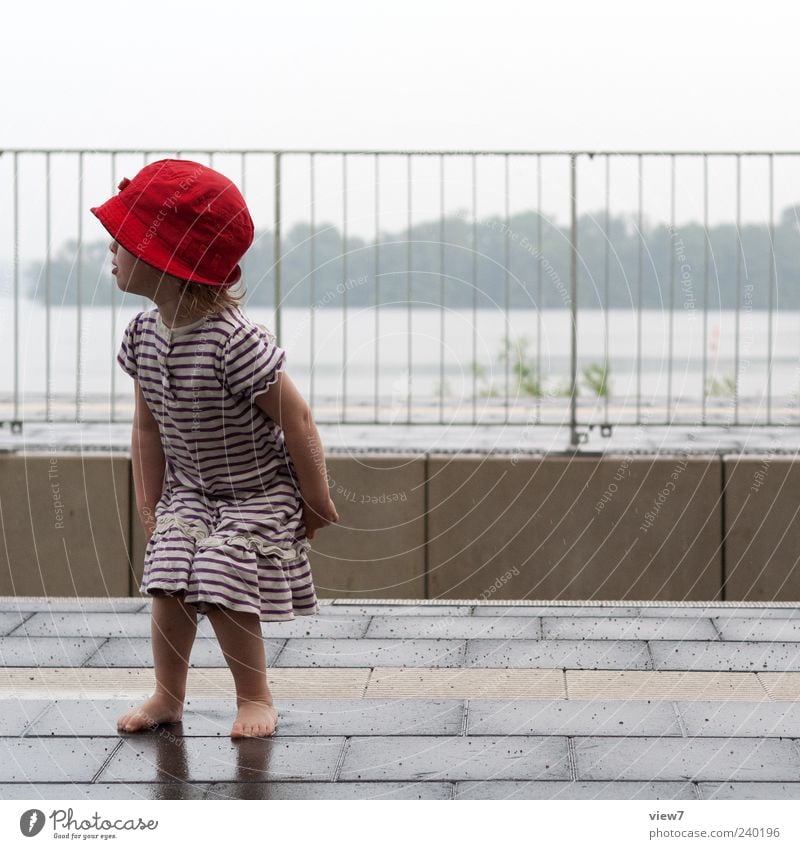 A train will come ... Human being Toddler Girl 1 1 - 3 years Sky Bad weather Rain Transport Train station Platform Dress Hat Cap Line Stripe Observe Discover