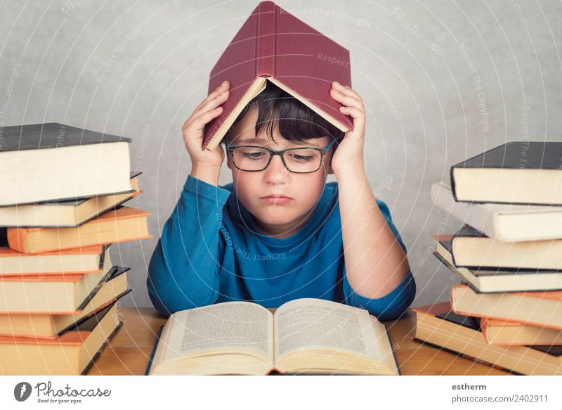 sad and pensive boy with books on a table Lifestyle Education School Study Schoolchild Student Human being Masculine Child Toddler Infancy 1 8 - 13 years