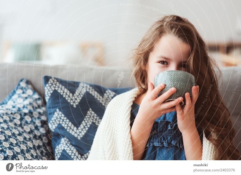 child girl drinking hot tea to recover from flu Tea Illness Relaxation Winter Child To enjoy Smiling Sit Hot Small Modern Natural Tradition kid health cup Wrap