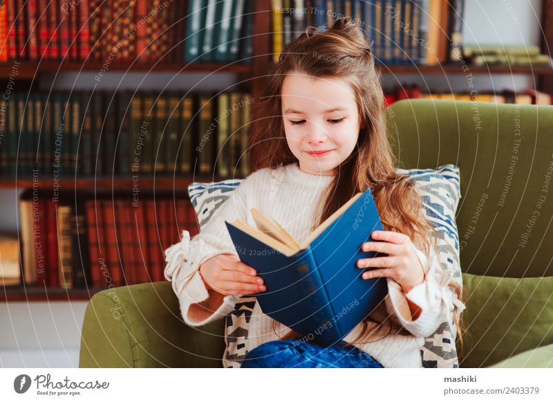 happy smart schoolgirl reading books Happy Reading Child School Classroom Schoolchild Infancy Book Library Smiling Small Smart Concentrate Creativity kid learn