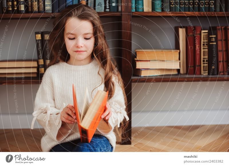 happy smart schoolgirl reading books Reading Child School Classroom Schoolchild Infancy Book Library Smiling Small Smart Concentrate Creativity kid learn