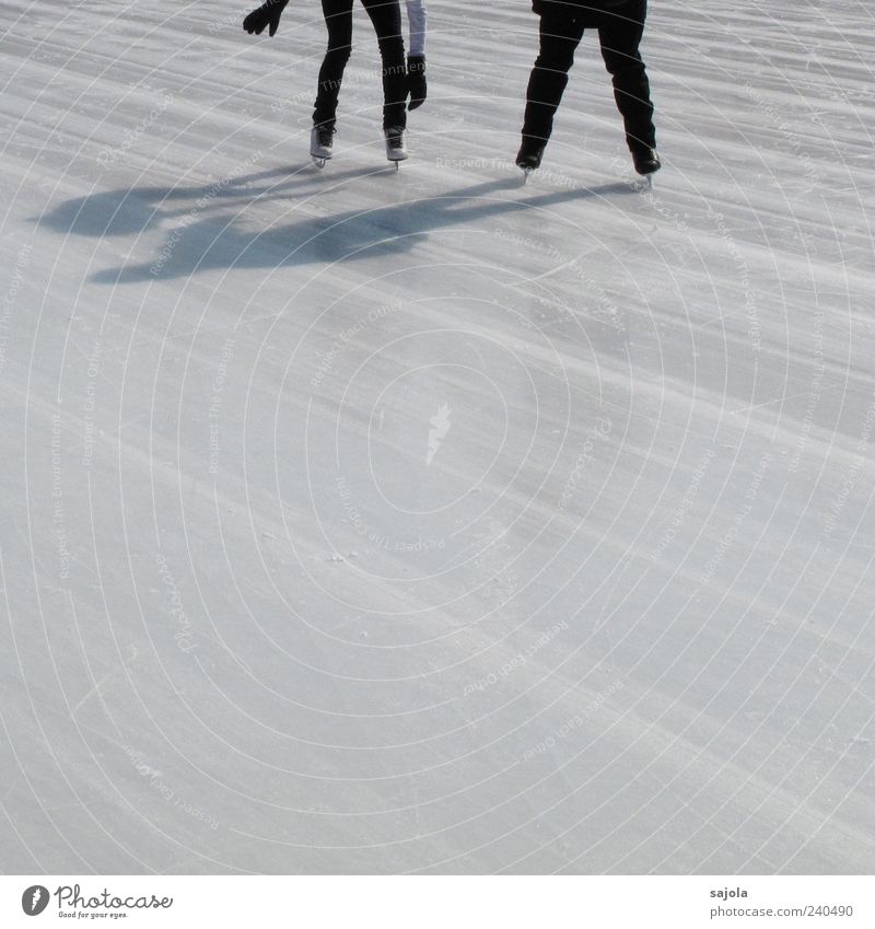 offer help Winter sports Ice-skating Human being 2 Driving Stand White Frozen surface Line Shadow play Colour photo Exterior shot Copy Space bottom Day