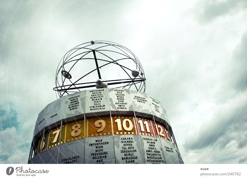 time zone Tourism Clock Art Environment Sky Clouds Weather Capital city Manmade structures Tourist Attraction Landmark Sign Digits and numbers Round Blue Time