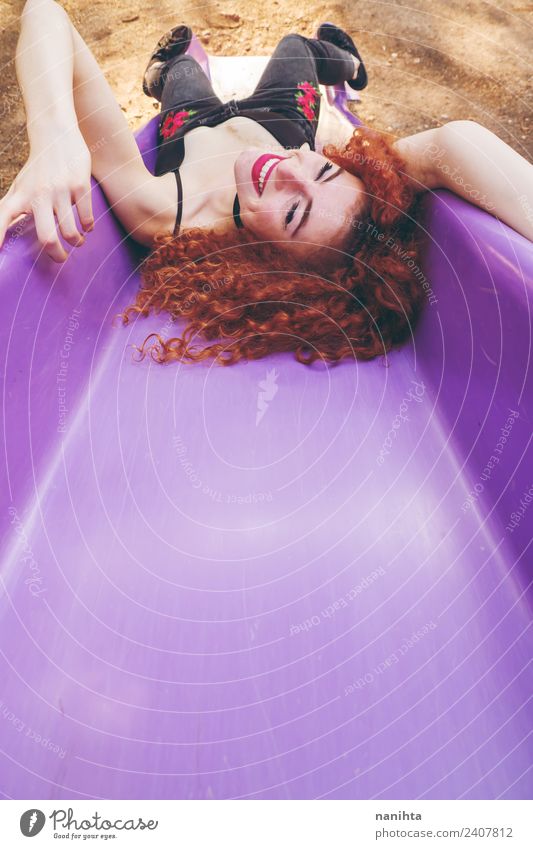 Happy redhead woman having fun in a slide Lifestyle Style Joy Beautiful Hair and hairstyles Wellness Well-being Human being Feminine Young woman
