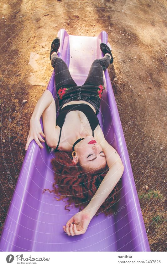 Young redhead woman sleeping in a slide Lifestyle Style Wellness Harmonious Relaxation Leisure and hobbies Human being Feminine Young woman Youth (Young adults)
