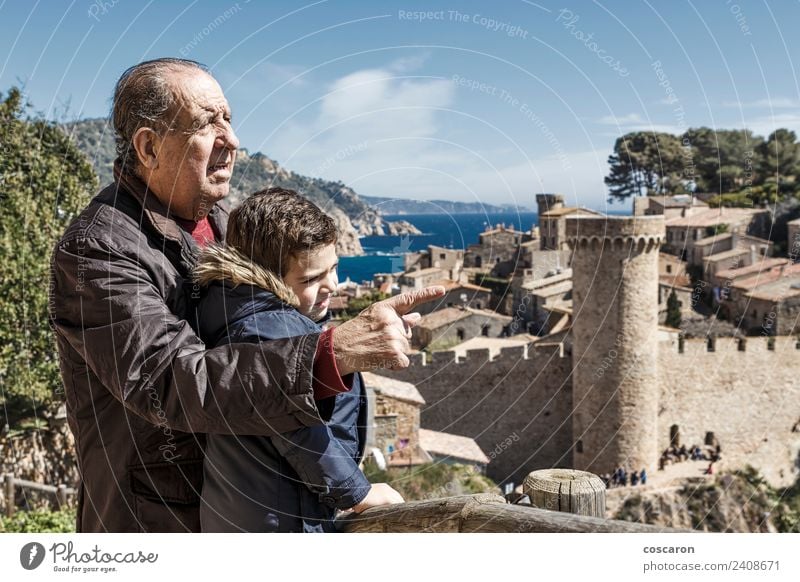 Grandfather and grandson in Tossa de Mar. Spain. Joy Vacation & Travel Beach Ocean Child Retirement Nature Park Town Castle Smiling Happiness Age Caucasian