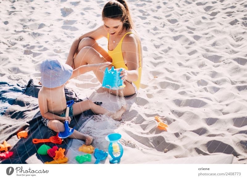 caucasian mother and son having fun at the beach Lifestyle Joy Happy Playing Vacation & Travel Summer Beach Child Boy (child) Woman Adults Parents Mother