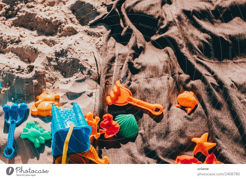 close up of some kid toys in the sand Joy Beautiful Summer Beach Infancy Nature Sand Toys Blue Green blanket pail orange Exterior shot Close-up Deserted